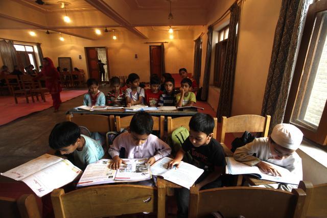 Kashmiri children study as they attend classes run by local volunteers. (Waseem Andrabi/HT Photo) Kashmiri children study as they attend classes run by local volunteers. (Waseem Andrabi/HT Photo)