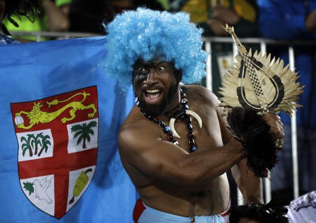 A Fiji fan celebrates his country's gold medal victory over Britain in the men’s rugby sevens. (AP Photo) A Fiji fan celebrates his country's gold medal victory over Britain in the men’s rugby sevens. (AP Photo)