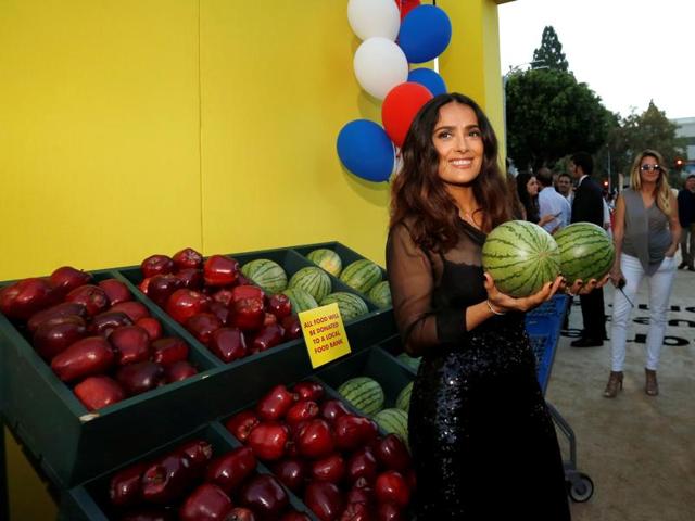 Salma Hayek holds two melons as she poses at the premiere for the movie Sausage Party. (REUTERS) Salma Hayek holds two melons as she poses at the premiere for the movie Sausage Party. (REUTERS)