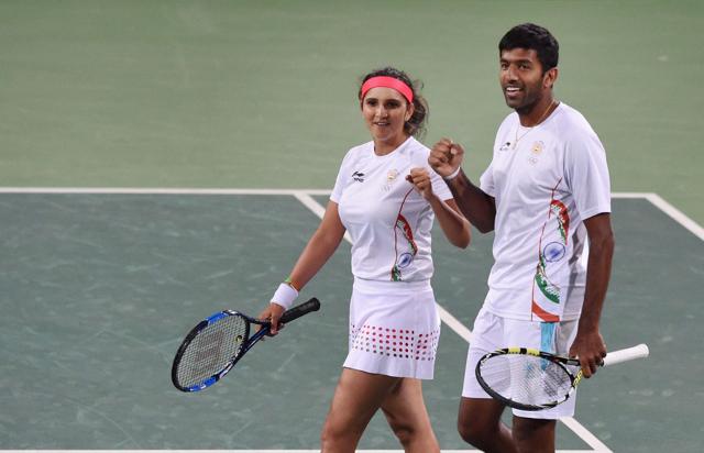 A good victory equals happiness! Sania Mirza and Rohan Bopanna are all smiles after beating Andy Murray and Heather Watson of Great Britain to enter the semi-finals . (PTI)
