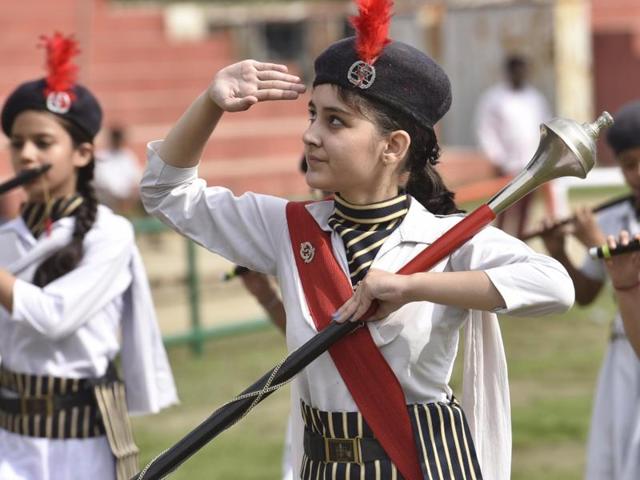 A student saluting during parade at the full dress rehearsal for Independence Day celebration in Amritsar on Saturday. (Gurpreet Singh/HT Photo)