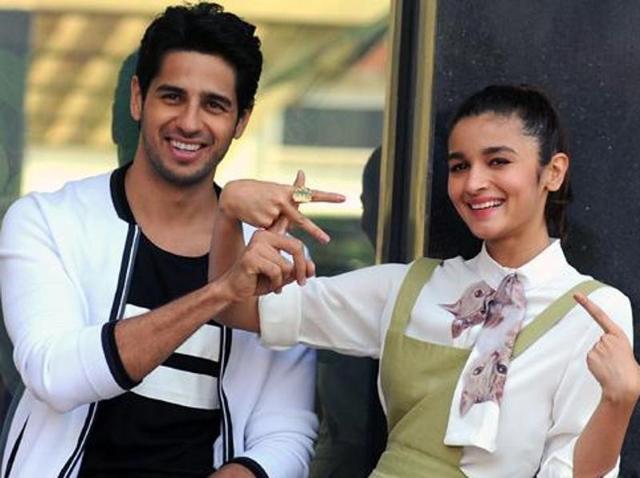 Sidharth Malhotra and Alia Bhatt pose during a promotional event for their film Kapoor and Sons in Mumbai. (AFP)