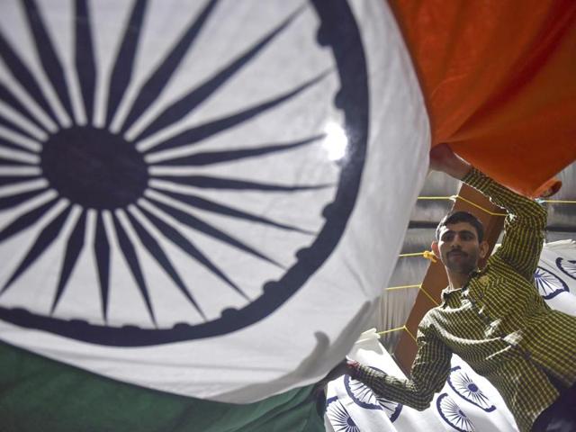 A man folds the national flag at a workshop in Borivali, Mumbai. (Pratham Gokhale/ht photo) A man folds the national flag at a workshop in Borivali, Mumbai. (Pratham Gokhale/ht photo)
