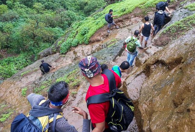 Trekkers begin their descend towards the base village from Kalavantin Durg. (Pratik Chorge)