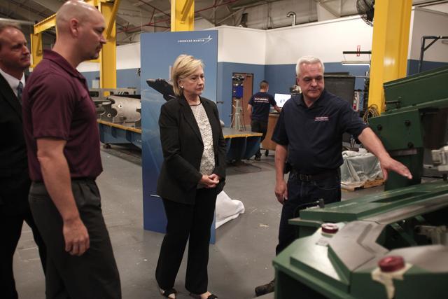 Democratic presidential nominee Hillary Clinton tours Futuramic Tool & Engineering before giving a speech there on the US economy on August 11, 2016 in Warren, Michigan. (AFP) Democratic presidential nominee Hillary Clinton tours Futuramic Tool & Engineering before giving a speech there on the US economy on August 11, 2016 in Warren, Michigan. (AFP)