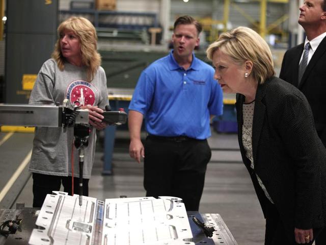 Hillary Clinton tours a factory in Warren, Michigan, before giving a speech there on the U.S. economy. (AFP) Hillary Clinton tours a factory in Warren, Michigan, before giving a speech there on the U.S. economy. (AFP)