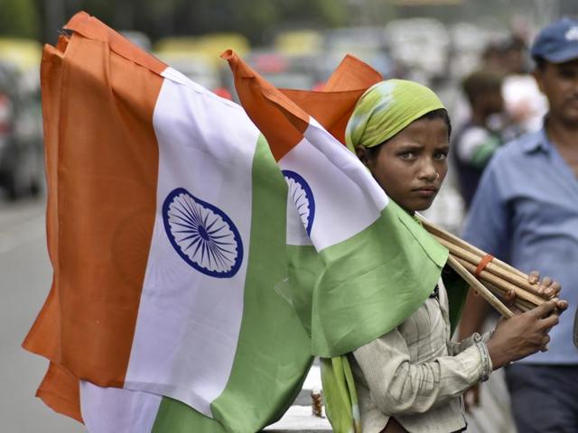 A woman sells the national flag ahead of the Independence Day celebration at Chirag Delhi. (S.Burmaula /ht photo) A woman sells the national flag ahead of the Independence Day celebration at Chirag Delhi. (S.Burmaula /ht photo)