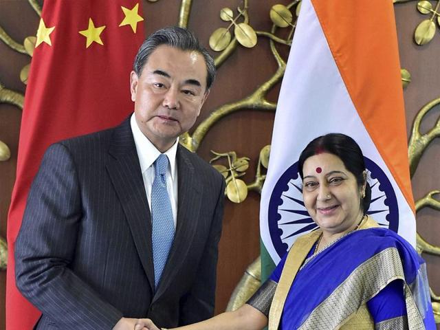 Visiting Chinese foreign minister Wang Yi, left, poses with external affairs minister Sushma Swaraj during a meeting in New Delhi on Saturday.(PTI via AP)
