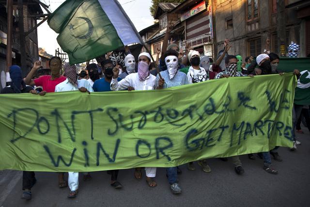 Kashmiri protesters shout slogans during a protest on Friday. (AP)