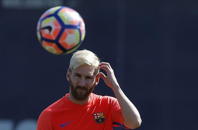 FC Barcelona's Lionel Messi looks at the ball during a training session at the Sports Centre in Sant Joan Despi, Spain. (AP Photo) FC Barcelona's Lionel Messi looks at the ball during a training session at the Sports Centre in Sant Joan Despi, Spain. (AP Photo)