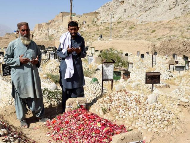 Relatives pray beside the grave of a lawyer who was killed in an Aug. 8 suicide bombing at the Civil Hospital in Quetta. (AFP) Relatives pray beside the grave of a lawyer who was killed in an Aug. 8 suicide bombing at the Civil Hospital in Quetta. (AFP)