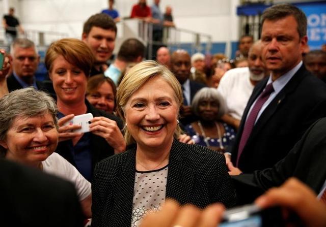 Hillary Clinton with supporters at Futuramic Tool &amp; Engineering in Warren, Michigan on Thursday/ (Reuters )