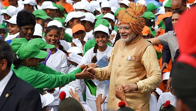 Prime Minister Narendra Modi is greeted as he walks among schoolchildren after delivering his Independence Day speech from the Red Fort in New Delhi. (AFP File Photo)