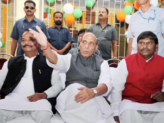 Union home minister Rajnath Singh along with Jharkhand chief minister Raghubar Das during the laying foundation stone for Developmental Projects at birth place of legendary freedom fighter Bhagwan Birsa Munda. (PTI Photo) Union home minister Rajnath Singh along with Jharkhand chief minister Raghubar Das during the laying foundation stone for Developmental Projects at birth place of legendary freedom fighter Bhagwan Birsa Munda. (PTI Photo)