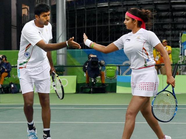 Sania Mirza and Rohan Bopanna entered the semi-finals of the mixed doubles tennis event by defeating Andy Murray and Heather Watson of Britain in straight sets. (PTI Photo)