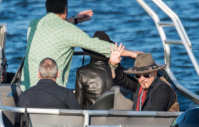 US actor Johnny Depp waves from a boat on his way to the concert with his band Hollywood Vampires at the Grona Lund amusement park in Stockholm. (AFP) US actor Johnny Depp waves from a boat on his way to the concert with his band Hollywood Vampires at the Grona Lund amusement park in Stockholm. (AFP)