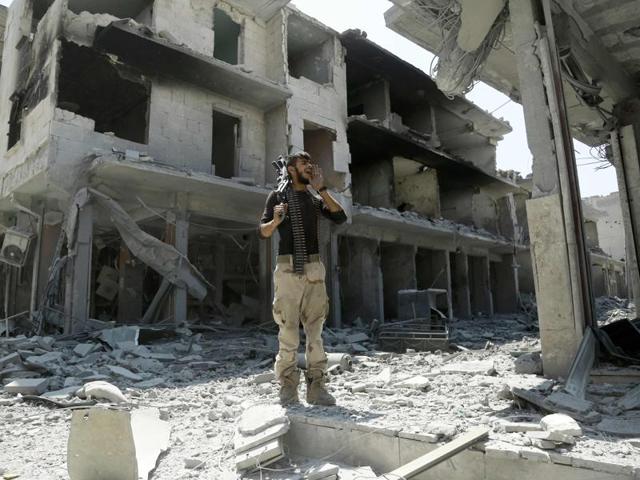 A member of the Syrian Democratic Forces (SDF) patrols a street in the northern Syrian town of Manbij a day after SDF retook it from the Islamic State. (AFP) A member of the Syrian Democratic Forces (SDF) patrols a street in the northern Syrian town of Manbij a day after SDF retook it from the Islamic State. (AFP)