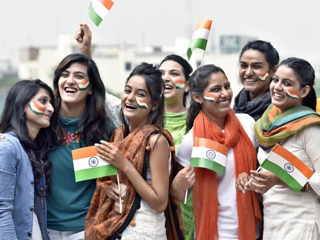 College girls with faces painted in tricolor on the eve of Independence Day in Amritsar on Sunday. (Gurpreet Singh/HT Photo)