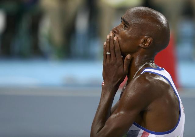 Mo Farah of Britain reacts after winning the men's 10,000m final. (REUTERS)