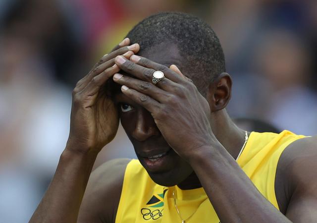 Usain Bolt reacts during his 100m heats. (REUTERS) Usain Bolt reacts during his 100m heats. (REUTERS)