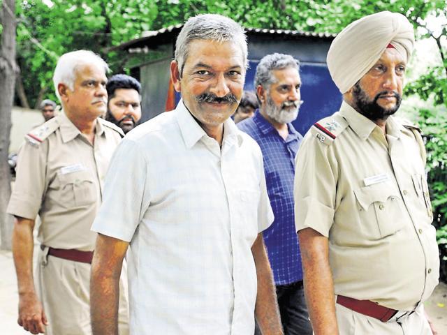 Head constable Balwan Singh (white shirt) in custody at the Sector-45 police post in Chandigarh.(Anil Dayal/HT File) Head constable Balwan Singh (white shirt) in custody at the Sector-45 police post in Chandigarh.(Anil Dayal/HT File)