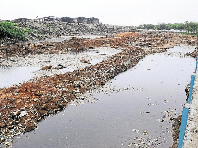Since the Bandhwari plant is at a higher level than neighbouring areas, the leachate flows in all directions naturally. Collection of leachate in a pit has led to formation of a polluted pond. (Parveen Kumar/HT) Since the Bandhwari plant is at a higher level than neighbouring areas, the leachate flows in all directions naturally. Collection of leachate in a pit has led to formation of a polluted pond. (Parveen Kumar/HT)