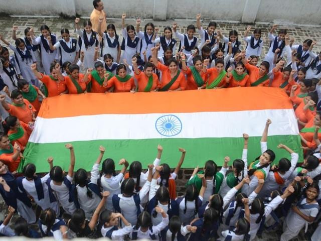 Students of Jagat Jyoti school celebrating the Independence Day in school premises in Amritsar on Saturday. (Sameer Sehgal/HT Photo)