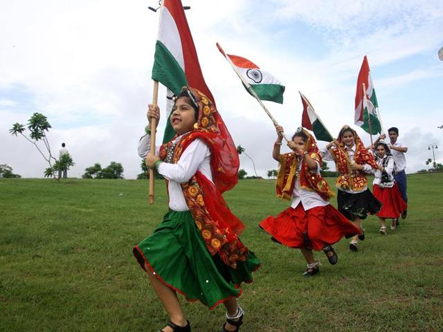 In the run-up to the 70th Independence Day, students of Model School, Rohtak, proudly carrying the Tricolour at the Rajiv Gandhi Sports Complex on Sunday. (Manoj Dhaka/HT Photo)