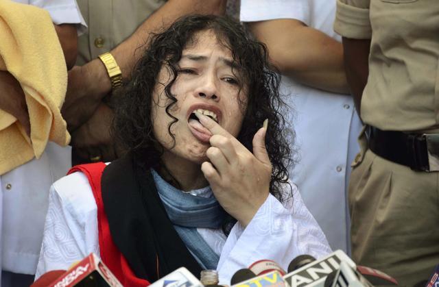 Irom Sharmila licks honey from her hand to break her fast during a press conference in Imphal. (PTI) Irom Sharmila licks honey from her hand to break her fast during a press conference in Imphal. (PTI)