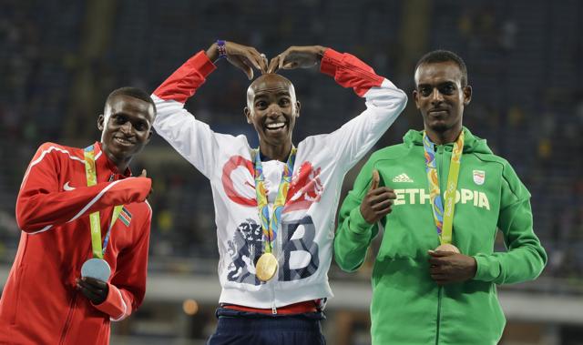 Paul Tanui of Kenya, left, was second in 27:05.64, and Tamirat Tola of Ethiopia was third in 27:06.26. (AP) Paul Tanui of Kenya, left, was second in 27:05.64, and Tamirat Tola of Ethiopia was third in 27:06.26. (AP)
