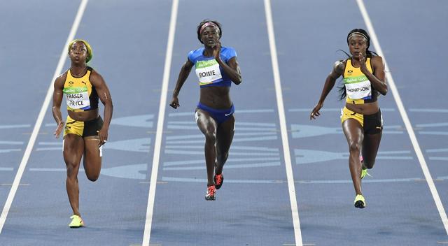 American Tori Bowie (centre) took silver in 10.83 while Fraser-Pryce (left), who was looking to become the first woman to win three successive gold medals in an individual athletics event, won bronze by a seven thousandths of a second in 10.86. (AP) American Tori Bowie (centre) took silver in 10.83 while Fraser-Pryce (left), who was looking to become the first woman to win three successive gold medals in an individual athletics event, won bronze by a seven thousandths of a second in 10.86. (AP)