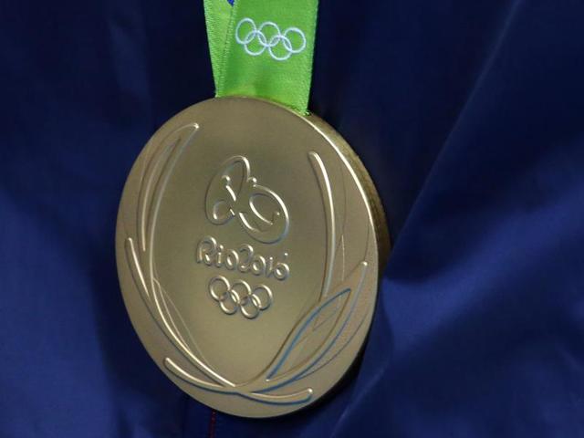 The honour of reaching the milestone was shared by, from left to right, Kathleen Baker, Lilly King, Dana Vollmer and Simone Manuel, who got to the wall first ahead of Australia.(AP)
