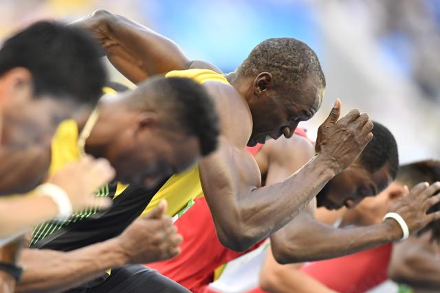 Bolt, the two-time defending Olympic champion , got off the blocks quickly and won his heat in 10.07 seconds. (AFP) Bolt, the two-time defending Olympic champion , got off the blocks quickly and won his heat in 10.07 seconds. (AFP)