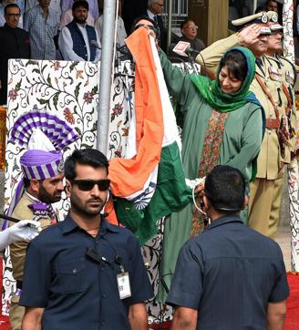 Jammu and Kashmir CM Mehbooba Mufti holds the tricolour. (PTI) Jammu and Kashmir CM Mehbooba Mufti holds the tricolour. (PTI)