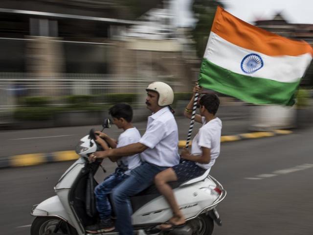 A family celebrates the spirit of independence at the Gateway of India in Mumbai on Monday. (satish bate/ ht photo) 