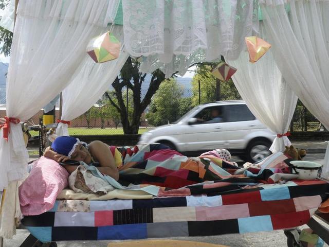 The festival is a socio-cultural event where a variety of art forms are showcased such as jazz, blues, salsa, rock, hip-hop, reggaeton, vallenato, electronic music, reggae and pop. A woman rests in bed on the street during lazy-day event. (AFP) The festival is a socio-cultural event where a variety of art forms are showcased such as jazz, blues, salsa, rock, hip-hop, reggaeton, vallenato, electronic music, reggae and pop. A woman rests in bed on the street during lazy-day event. (AFP)