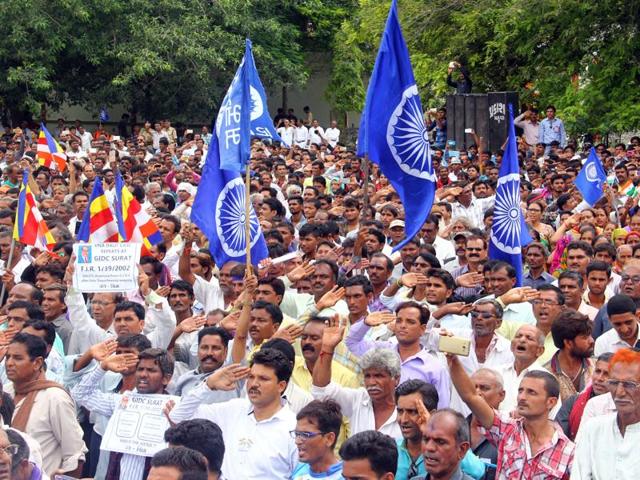 Dalits protesters at the flag-hoisting ceremony during a rally in Una in Gujarat.(Siddharaj Solanki/HT Photo)