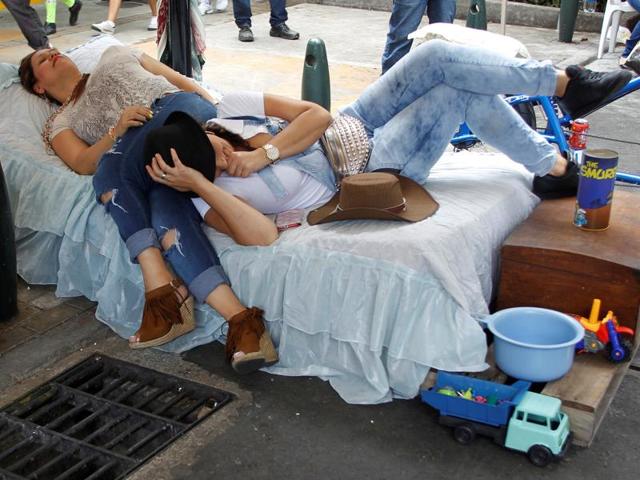 Women lay in bed to experience an unhurried way of life. (REUTERS) Women lay in bed to experience an unhurried way of life. (REUTERS)
