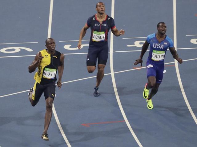 The fastest man in the world retains his title clocking 9.81 seconds, 0.08 seconds ahead of Gatlin (right). (AP photo)