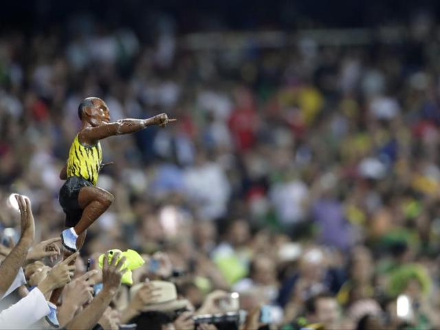 A miniature model of Bolt too was in the crowd to support the great champ. (AP photo)