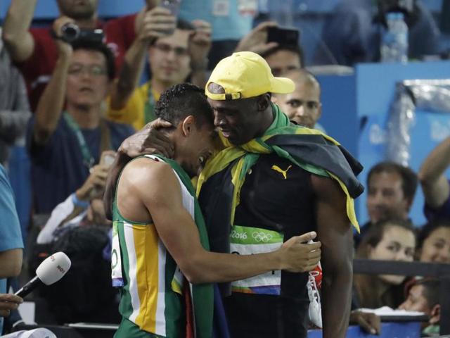 Bolt embraces South Africa's Wayde Van Niekerk, the night’s other headline maker, who won the 400 metre gold medal after smashing American Michael Johnson’s world record that stood since 1999. (AP photo)