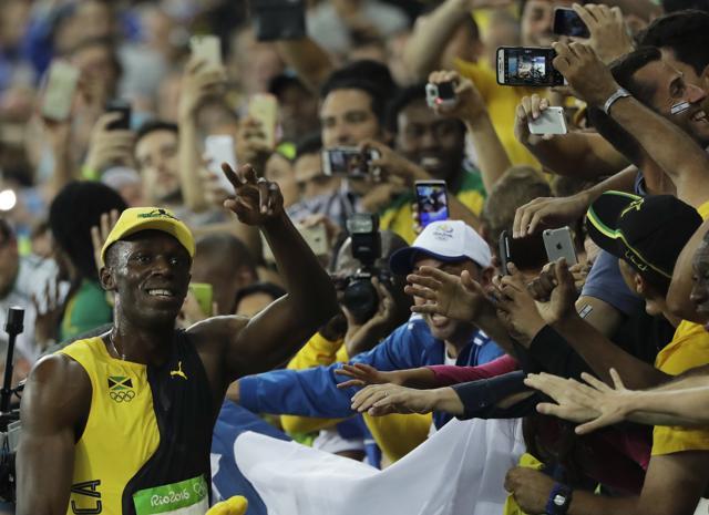 Jamaica's Usain Bolt celebrates after his historic win at the Olympic stadium in Rio de Janeiro, Brazil, Sunday. (AP Photo) Jamaica's Usain Bolt celebrates after his historic win at the Olympic stadium in Rio de Janeiro, Brazil, Sunday. (AP Photo)