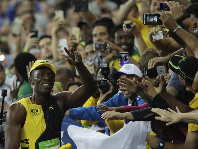 Bolt obliges the fans as well. (AP photo)