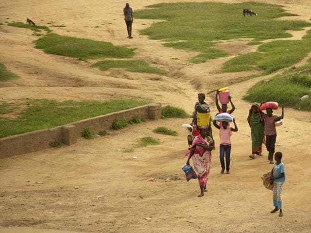 People walk with their belongings in the capital Juba, South Sudan.(AP) People walk with their belongings in the capital Juba, South Sudan.(AP)