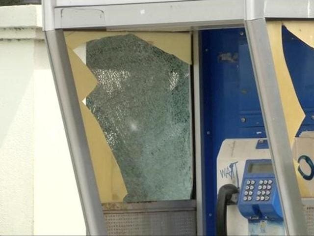 A damaged public telephone booth is seen at the site of a bomb blast in Hua Hin, south of Bangkok, Thailand, in this still image taken from video August 12, 2016. (Reuters Photo) A damaged public telephone booth is seen at the site of a bomb blast in Hua Hin, south of Bangkok, Thailand, in this still image taken from video August 12, 2016. (Reuters Photo)