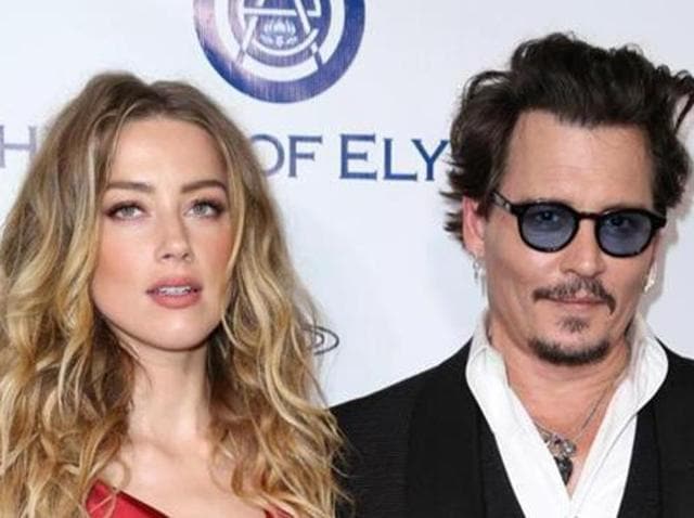 In this file photo, Amber Heard and Johnny Depp arrive at The Art of Elysium’s Ninth annual Heaven Gala.(AP)