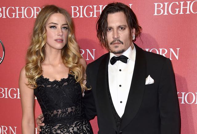 In this file photo, Amber Heard, left, and Johnny Depp arrive at the 27th annual Palm Springs International Film Festival Awards Gala in Palm Springs, Calif. Heard is withdrawing allegations that Depp physically abused her and has settled her divorce case with the Oscar-nominated actor. Heard filed for divorce in May and days later obtained a temporary restraining order accusing the Pirates of the Caribbean star of hitting her during a fight in their Los Angeles apartment in May. (Jordan Strauss/Invision/AP)
