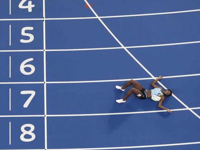 Millen then lay on the track, clearly emotional. (AP) Millen then lay on the track, clearly emotional. (AP)