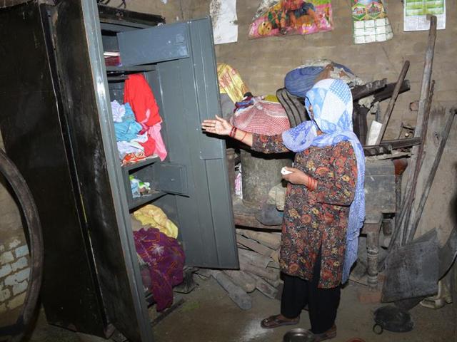The family’s matriarch shows the broken locks of a cupboard that was ransacked the night of July 19, 2014, in Ghaziabad. After robbing the family, the men abducted the daughter-in-law and allegedly raped her. (Sakib Ali/HT Photo) The family’s matriarch shows the broken locks of a cupboard that was ransacked the night of July 19, 2014, in Ghaziabad. After robbing the family, the men abducted the daughter-in-law and allegedly raped her. (Sakib Ali/HT Photo)