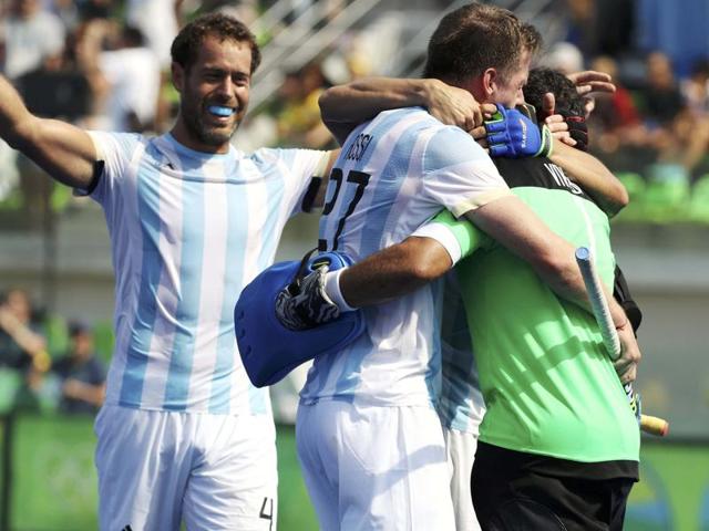 Argentina's Joaquin Menini, left, celebrates with teammates his goal against Germany. (AP Photo) Argentina's Joaquin Menini, left, celebrates with teammates his goal against Germany. (AP Photo)